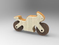 a wooden toy horse with wheels on a gray background