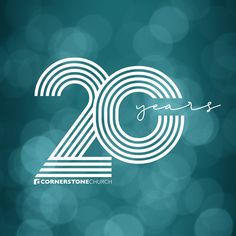 the 20th anniversary logo is displayed on a blurry blue and green background with white circles