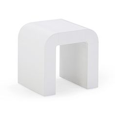 a white stool with an arch shaped design