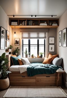 a small bedroom with a bed, window and plants in the corner on shelves above it