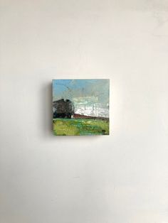 a painting hanging on the side of a wall