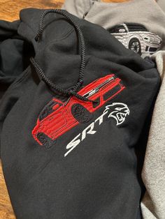 This Hoodie Is From Algo Melhor's Season 4 Drop. Prices Increase After the Drop Has Finished. For Next Seasons Drop Please Follow Our Instagram/Tik Tok @algomelhorapparel. Hell Cat Embroidered Hoodie CHOOSE YOUR COLOR CAR ON THE PERSONALIZATION SECTION ✅ALL ITEMS ARE MADE TO ORDER (shipping times can vary from 1 week to 3-4 weeks. I am one individual doing this, please understand.  🧵 All Items Are Custom Made By Me Unless Stated Otherwise.  📲 Please Feel Free to Message Me If You Have Any Ques Hoodie Design Embroidery, Car Hoodies, Gift For Car Lover, Car Sweatshirt, Hell Cat, Car Hoodie, Charger Hellcat, Watch One Piece, Photo Care