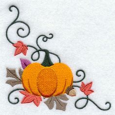 a white towel with an embroidered pumpkin on it