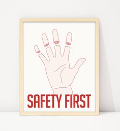 the safety first poster is hanging on a wall next to a white shelf with an orange frame