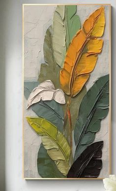 a painting with yellow and green leaves on it