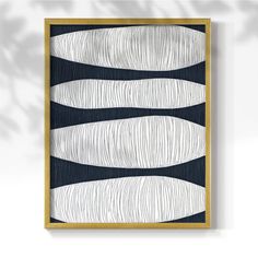 an abstract painting with black and white lines on the bottom, in a gold frame