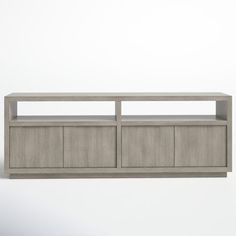 an entertainment center made out of concrete with two doors and three shelves on each side