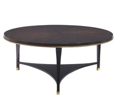 an oval coffee table with black wood and gold trimmings on the top, against a white background