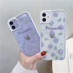 a person holding up a phone case with flowers on it