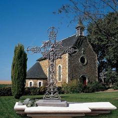 a church with a cross in front of it