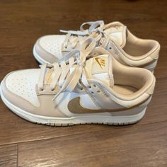 New Nike Dunks Beige And Gold Women’s Size 7 Or Men’s Size 5.5 (Comes With Box) Cute Nike Dunks For Women, Nike Dunks Cream, Staple Sneakers For Women, Daily Shoes Women, Beige Shoes Women, Tan Nike Dunks, Women’s Nike Dunks, Nike Dunks For Women, Shoe Inspo Women