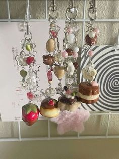 a bunch of food hanging from a hook on a tiled wall next to a sign