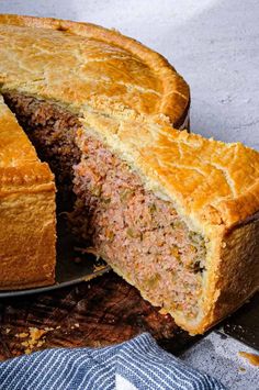 a meatloaf is cut in half on a plate and ready to be eaten