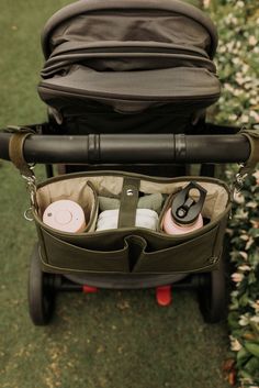 an open stroller with baby items in it