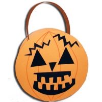 an orange and black pumpkin shaped bag on a white background