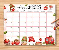 a calendar with apples and gnomes on it, next to pencils and an apple