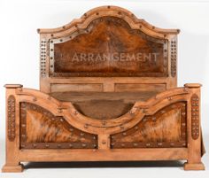 an antique wooden bed frame with the words the arrangement on it's headboard