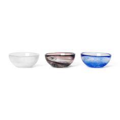 three glass bowls sitting next to each other