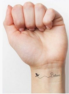 a person with a small tattoo on their wrist and an image of the same hand