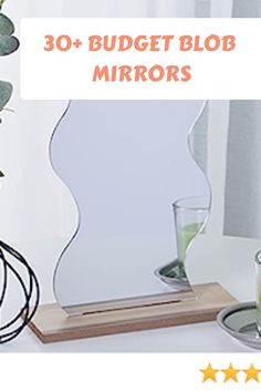 an image of a mirror with the words 30 + budget blob mirrors