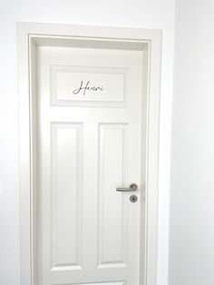 a white door with the word home written on it