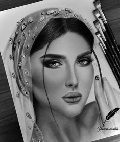 a pencil drawing of a woman's face with eyes and headdress on