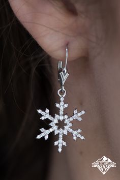 Pavé set diamonds with a combined .66 total carat weight illuminate the intricate and delicate outline of these striking earrings. Designed and expertly hand crafted by the artists at Park City Jewelers to gently sway and brightly shimmer as you move throughout the day and into the night. Lever backs provide an added measure of security and complete the elegant and alluring style of these amazing snowflake earrings. Snow Flake Earrings, Abby Abominable, Snowflake Accessories, Snowflake Clothes, Jazz Wedding, Snow Earrings, Abbey Bominable, Winter Dance, Snowflake Jewelry