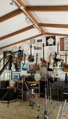 a room filled with guitars and musical equipment