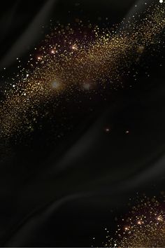 a black background with gold dust and stars