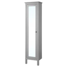 a tall white cabinet with mirrored doors