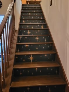 the stairs are decorated with gold stars