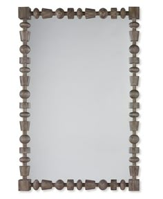 a mirror that is made out of wood and has holes in the bottom half of it