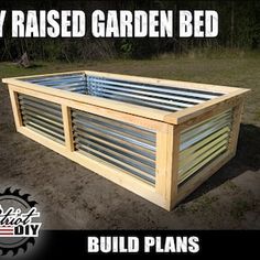 the raised garden bed is made out of wood and has metal slats on it