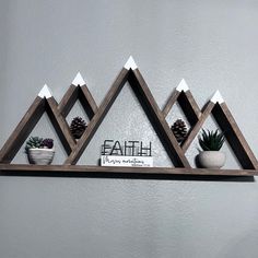 three wooden shelves with plants on them and a sign that says faith above the top