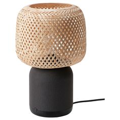 the bamboo table lamp is made from black plastic and has a woven shade on top