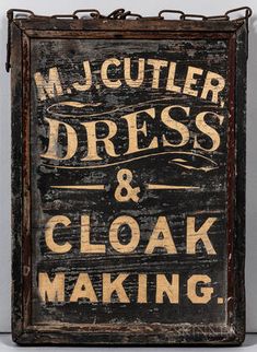 an old sign that says, m mcculeer dress and cloak making on it