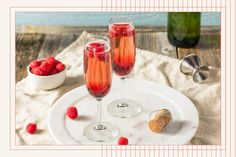 two glasses of raspberry champagne on a white plate