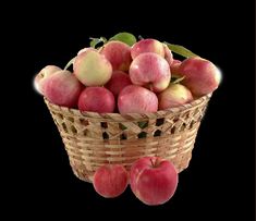 a basket filled with lots of red apples