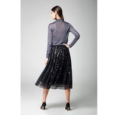 Our Fairy midi sequin skirt is sure to land you on the best-dressed list. Made from delicate embellished tulle, this midi skirt is saturated with pailletes and has a flared line. Tuck a statement tee or an elegant blouse into the flexible elasticated waistband for a bold fashion statement. Details: Fastens with a zip at the back, Elasticated waistband, Tulle underskirt, Fully lined. Composition: 100% Polyester Care: Dry clean Glamorous Midi Skirt For Spring, Sequin Midi Skirt For Night Out, Glamorous Evening Skirt For Fall, Glamorous Knee-length Spring Skirt, Glamorous Knee-length Skirt For Spring, Chic Knee-length Sequined Skirt, Fall Sequined Skirt, Winter Evening Sequined Skirt, Winter Evening Skirt With Sequins