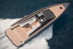 an aerial view of a motor boat in the open water, with its cockpit down