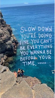 two people sitting on the edge of a cliff overlooking the ocean with a quote written above them