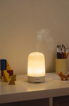 What it is: An essential oil diffuser that lights up to create a soft ambiance while scenting your home naturally. What it does: With a cute curved silhouette and compact size, it instantly elevates the vibe in any room while using ultrasonic vibrations to diffuse the fragrance. It's designed with durable materials and safety-off switches so you can operate it entirely free of hassle of worry.Diffusing capacity: 300 sq. ft. 3.4"W x 5.5"H Ultrasonic: 2.5 vibrations/second 4-hour and 8-hour settings Automatically turns off when time is up or water runs out BPA-free Plastic Imported Room Diffuser, Scent Diffuser, Fall Scents, Candle Diffuser, Birthday Wishlist, House Smells, The Vibe, Night Lamps, My New Room