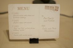 a menu sitting on top of a wooden table