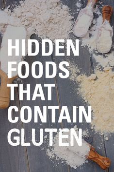 the words hidden foods that contain gluten on a wooden table with spoons and flour