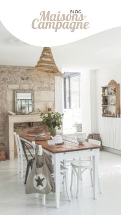 a dining room table and chairs in front of a brick wall with the words maison des campagne on it