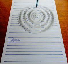 a paper with a spiral drawn on it