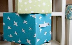 two boxes are stacked on top of each other in the shape of birds and polka dots