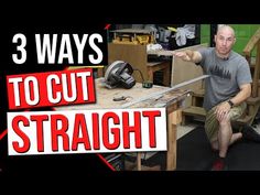 a man is sitting on the floor in front of a workbench and pointing at something