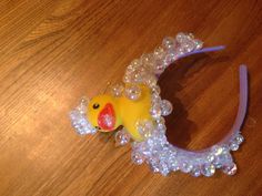 a rubber ducky headband with bubbles on it