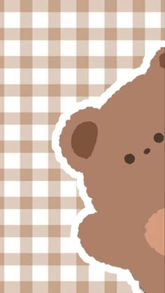 a brown teddy bear sitting on top of a checkered tablecloth covered wallpaper